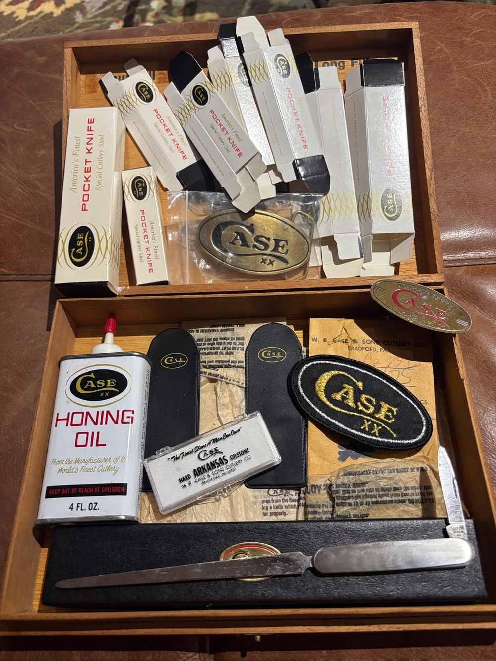 Case XX boxes letter opener sharpening stone patch belt buckle in cigar box